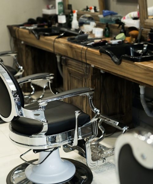 stylish-modern-barber-chairs-in-black-and-grey-barbershop-interior.jpg